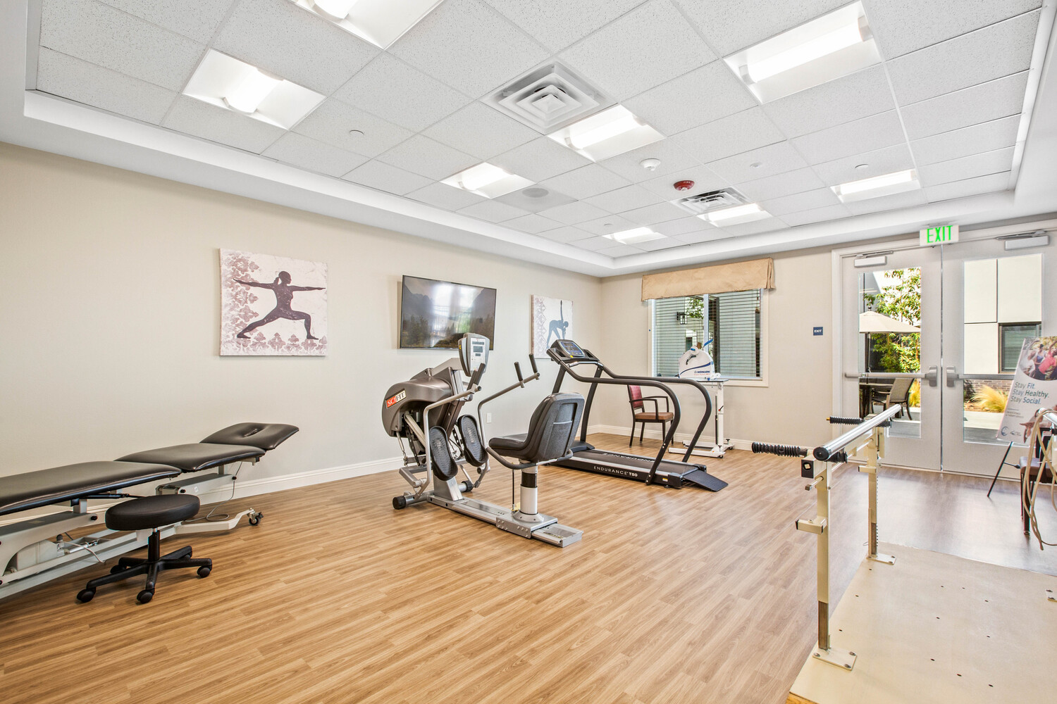 Gym with fitness equipment for assisted living residents to stay fit.